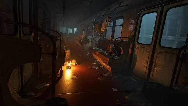A dark, abandoned subway carriage lit only by a small lantern on the floor