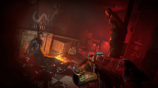 A red-lit room with bodies on the floor and a bandit standing over them as the player holds a gun