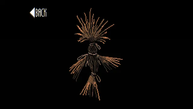 A close-up of a straw figure bound with string against a black background