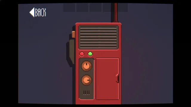 A close-up of a red walkie-talkie with two dials