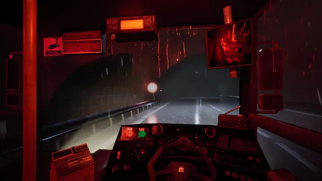 The bus cab bathed in red light as it drives into a dark tunnel in the rain