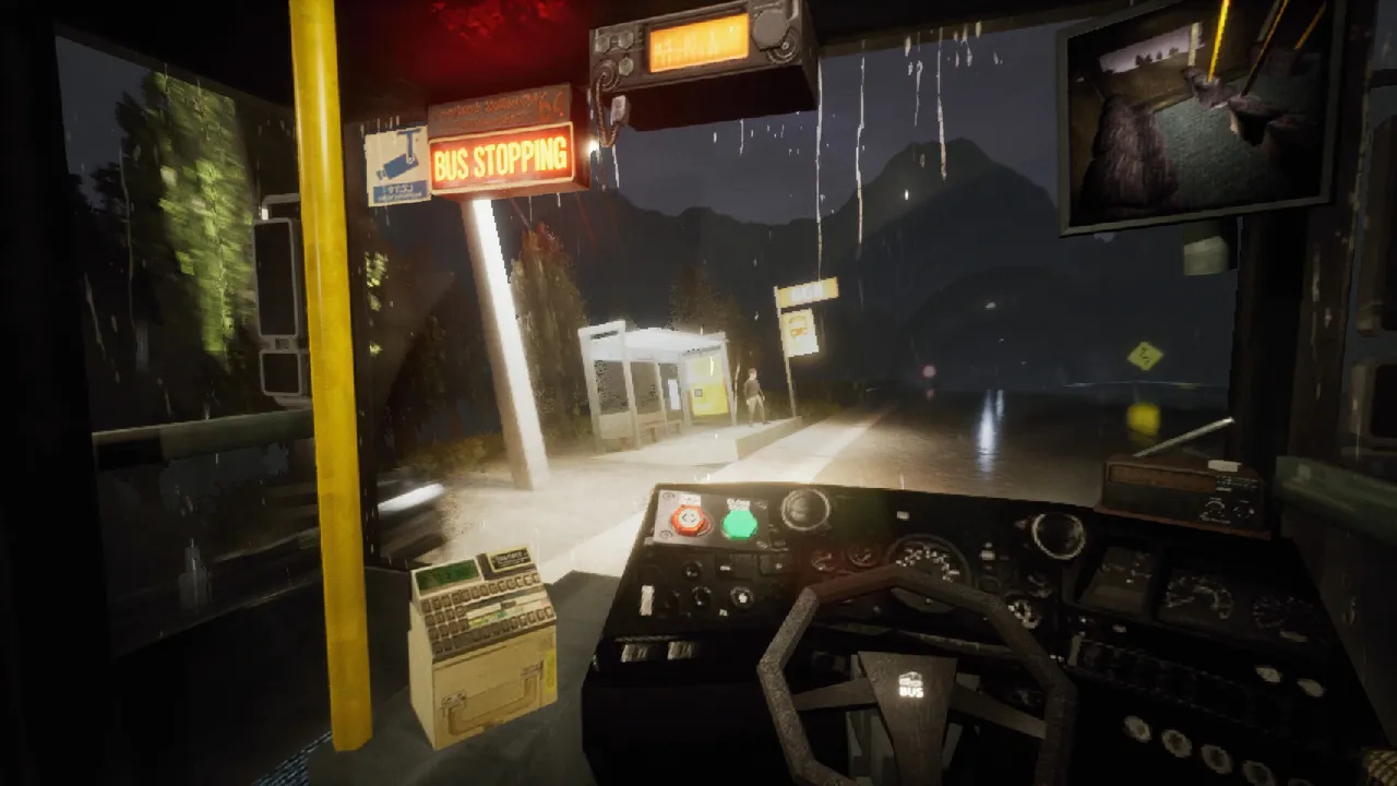 Night Bus driver's view at night: rain on the windscreen, a lit bus shelter with a waiting man and a CCTV monitor above the dashboard