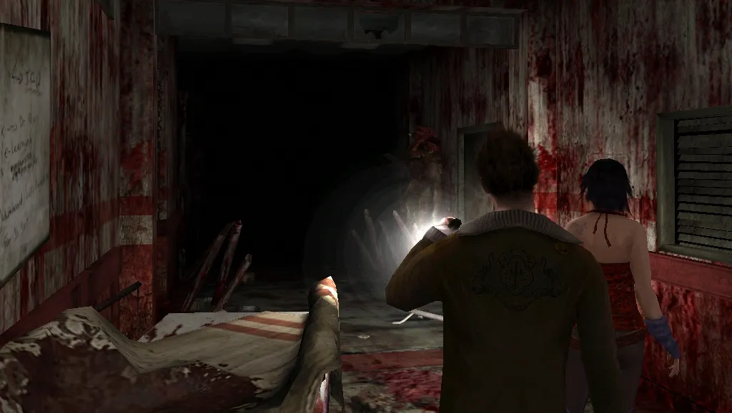 Two students with a flashlight entering a dark corridor with blood-spattered walls and a wrecked gurney