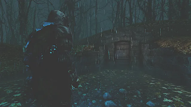 Of Love and Eternity screenshot: the hooded knight in the rain before a stone crypt door in a dark forest