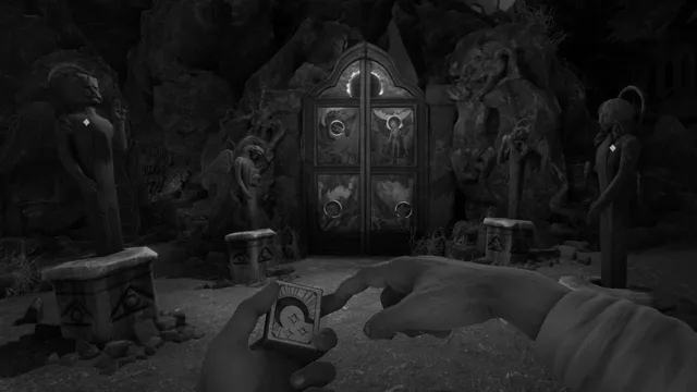 Ornate double doors in a rocky cave between carved statues, the player holding a matchbox