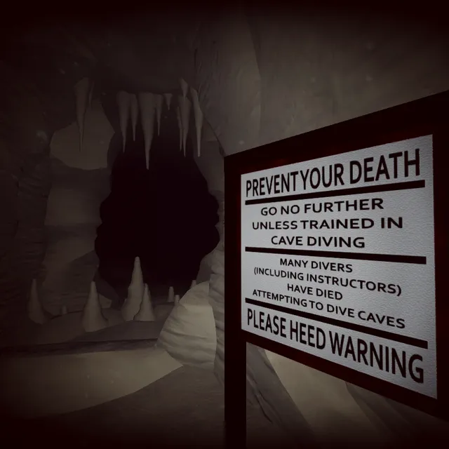 An underwater cave entrance with stalactites beside a sign reading Prevent your death: go no further unless trained in cave diving