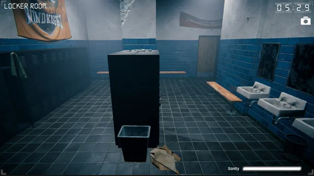 Para Eyes screenshot: a blue-tiled school locker room on camera at 05:29, with a tall dark cabinet in the middle