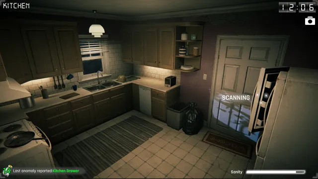 Para Eyes screenshot: a security camera view of a dim kitchen at 12:06, with the scanning mark on an open cabinet door and a sanity bar below