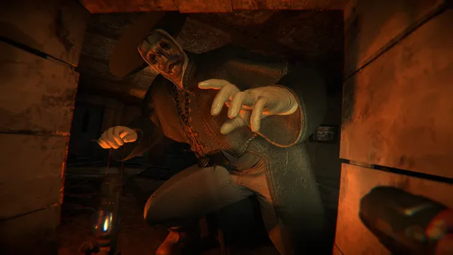 A grey-skinned figure in a hat lunging at the player from a doorway