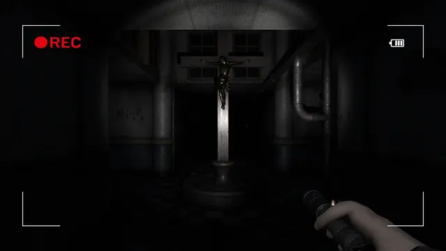 Paranormal Entities screenshot: a crucifix on a pedestal in a dark hall, seen through the camera with REC lit and a flashlight in hand