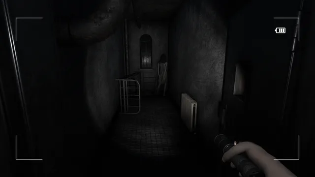 Paranormal Entities screenshot: a pentagram drawn across a checkered floor between stone pillars, lit by the flashlight