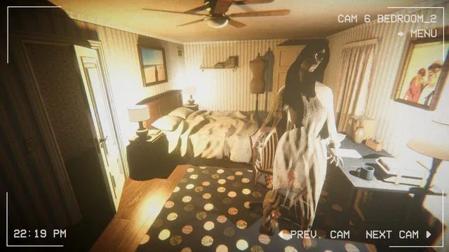 A camera view of a lit bedroom with a pale long-haired ghost in a white dress standing by the bed