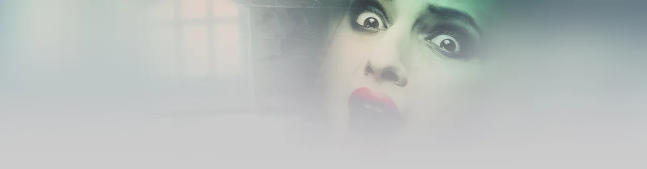 Phantasmagoria art from GOG: a woman's terrified, wide-eyed face fading into mist beside a dim window