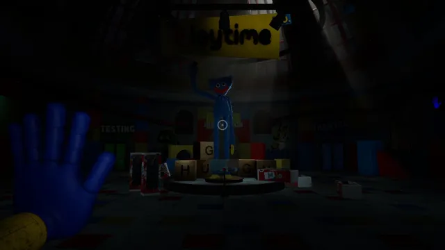 Poppy Playtime screenshot: the blue GrabPack hand in view as a tall Huggy Wuggy statue stands in the dark lobby under a Playtime sign