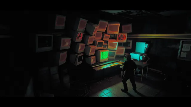 Roman in a dark room facing a wall of old CRT monitors, some showing red static