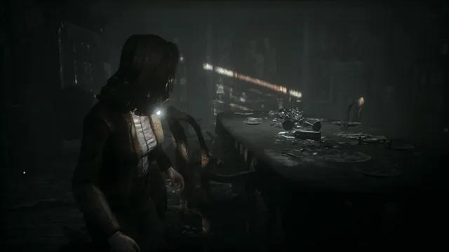Remothered: Tormented Fathers screenshot: Rosemary walks past a long dining table strewn with broken glass in a dim room