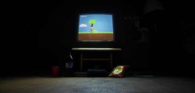 A dark bedroom floor with a cola bottle, a mug and a bag of snacks in front of the glowing TV