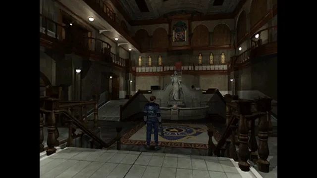 Resident Evil 2 (1998) screenshot: Leon stands in the marble main hall of the Raccoon City police station, a statue and balconies above him