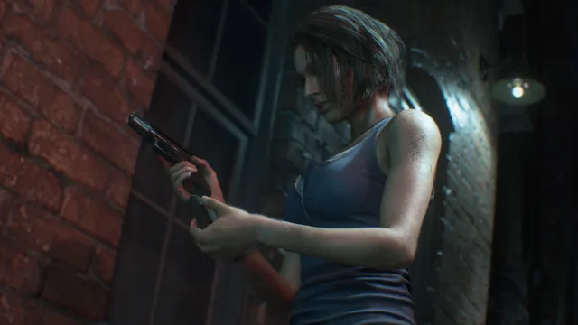 Resident Evil 3 screenshot: Jill checks her handgun beside a brick wall in a dark alley