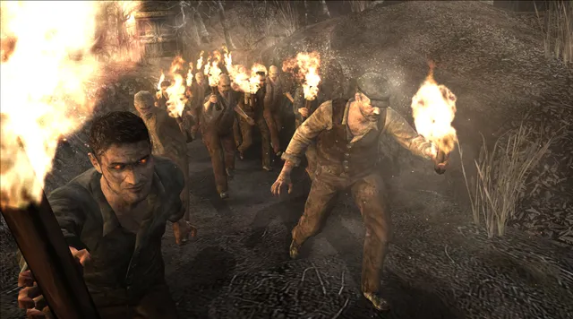 Resident Evil 4 (2005) screenshot: a crowd of villagers carrying burning torches walks through the dark