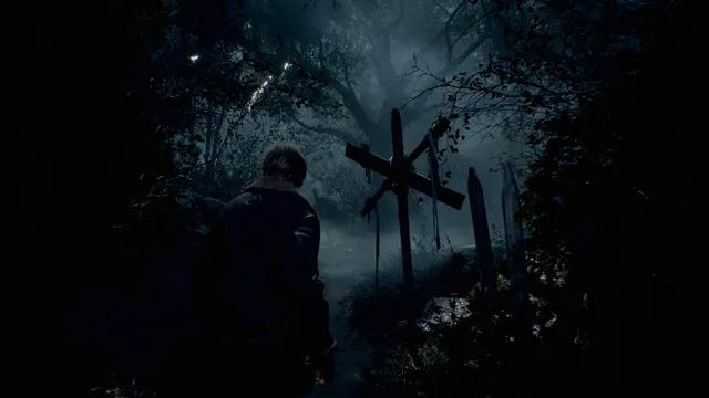 Resident Evil 4 screenshot: Leon seen from behind on a misty forest path facing a large wooden cross hung with cloth