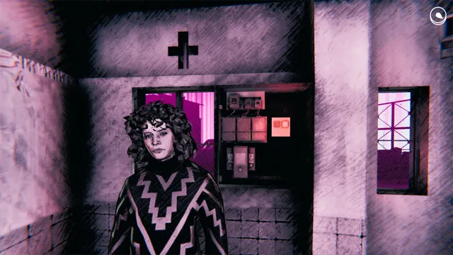 A curly-haired woman in a patterned sweater stands in a room with a cross on the wall
