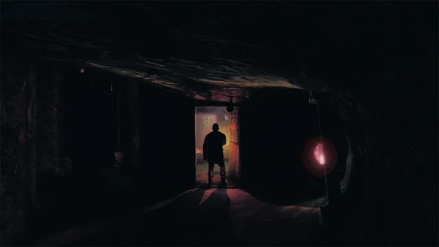 A silhouetted figure stands in a lit doorway at the end of a dark corridor