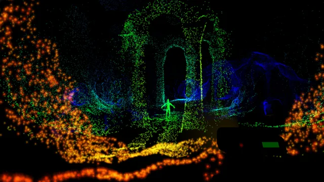 A cave chamber drawn in coloured LIDAR dots: green stone arches, a small human figure and orange dots across the floor in the dark