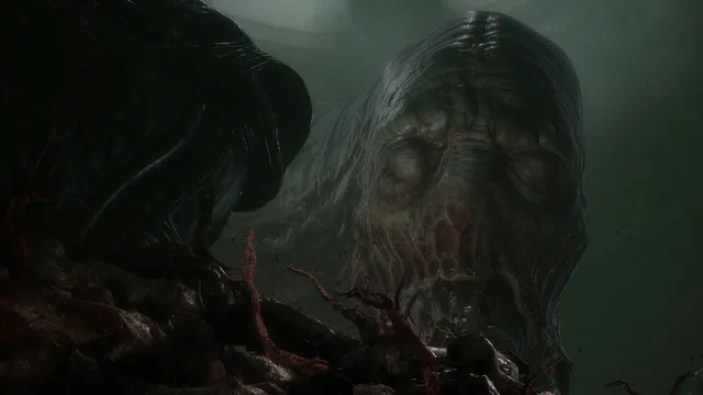 Scorn screenshot: a giant rotting head with a wrinkled, ribbed skull lies among red tendrils in a murky green chamber