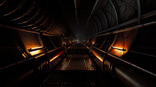 A long ribbed maintenance tunnel with a metal walkway lit by orange lamps