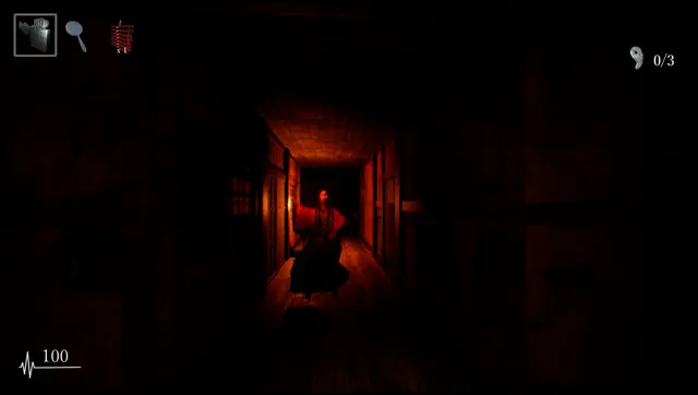 A long-haired figure in a kimono comes down a dark, narrow corridor lit by one candle