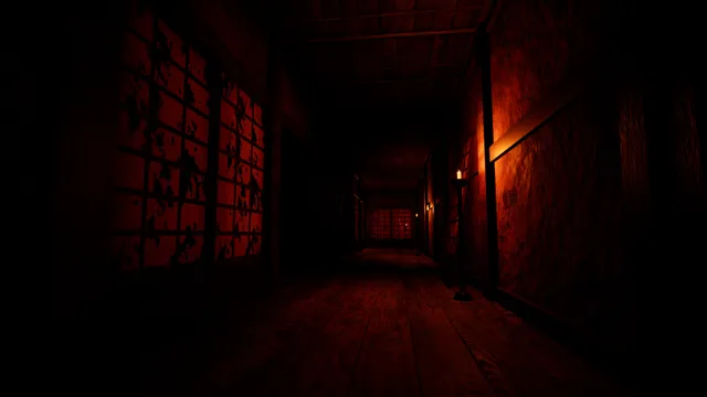 An empty wooden corridor with stained paper screens glowing red