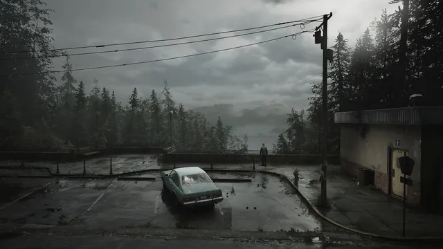 A grey overcast overlook with a lone parked car, a payphone and James walking toward a railing above a misty lake and pine forest
