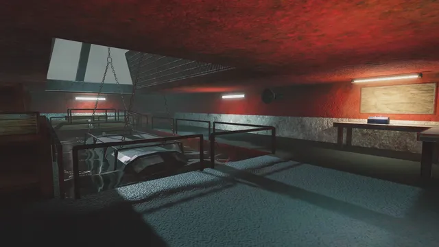 A red-walled room with chains hanging over a pool of dark water behind railings