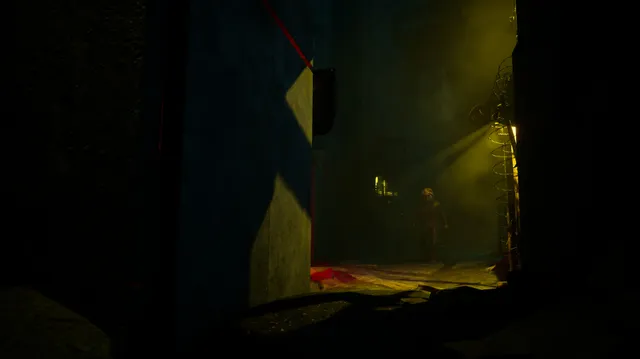 Hiding behind a wall as a masked figure with a weapon walks down a smoky yellow-lit alley