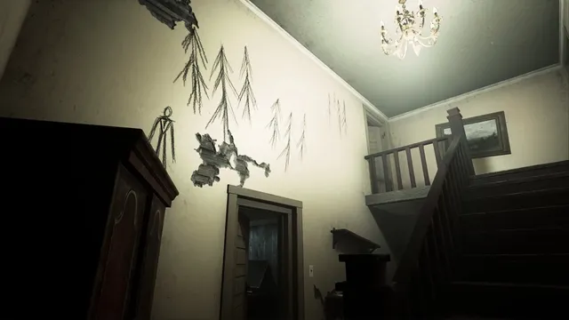 The hallway of an empty house with a staircase and crude drawings of trees and a tall figure scrawled on the wall
