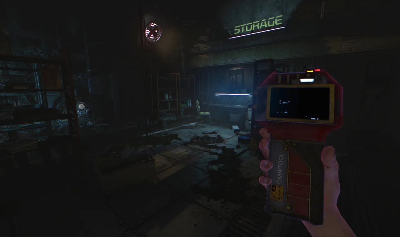 SOMA screenshot: Simon holds a red Omnitool device in a dim storage room of the station