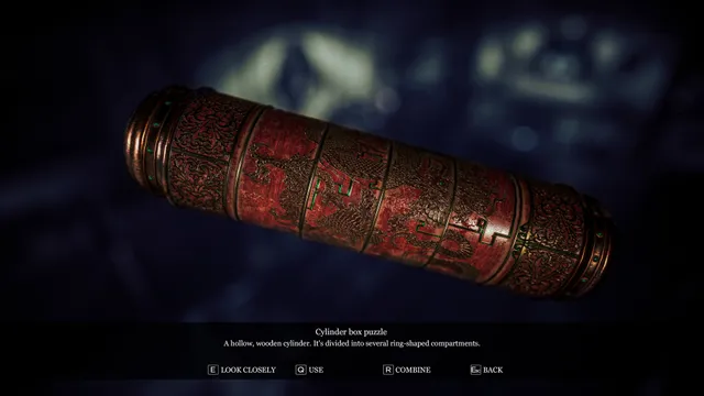 Song of Horror screenshot: examining a carved red cylinder box puzzle in the inventory