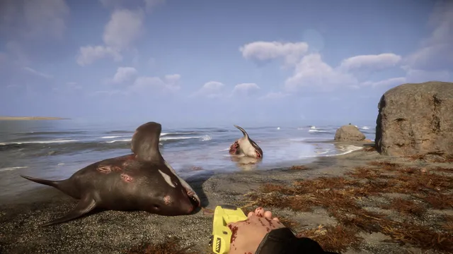 Sons Of The Forest screenshot: the player's bloodied hand holds a yellow GPS locator beside dead sharks on a beach
