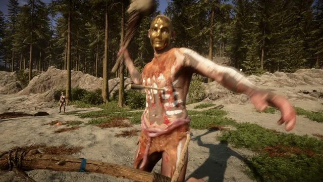 Sons Of The Forest screenshot: a blood-smeared cannibal in a gold mask swings a club at the player on a rocky clearing