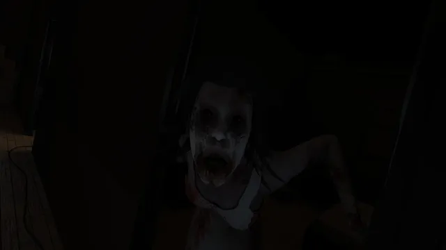 The pale girl with a bloodied mouth lunging at the camera out of the dark