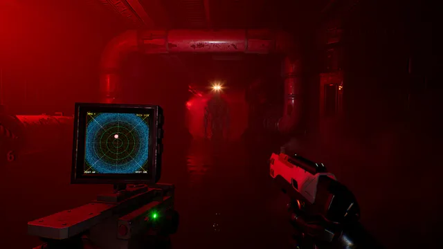 A red-lit corridor seen over a pistol and a motion tracker, with a shadowy figure standing far down the hall
