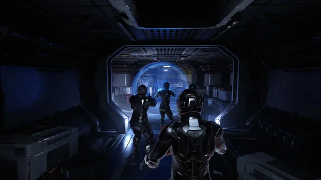 A squad of armoured players moves through a dark airlock into the ship