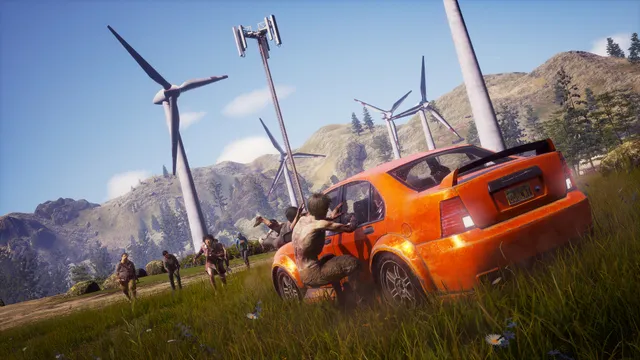State of Decay 2 screenshot: a zombie clings to an orange car as more of the dead walk through a field of wind turbines