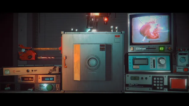 A lab bench of 1980s equipment with a sealed metal box, keypads and a CRT monitor showing a red object