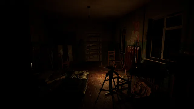 Summer of '58 screenshot: a dark room with a camera tripod and a candle burning on the floor