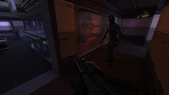 System Shock 2 remaster screenshot: a dark figure with red eyes stalks a dim corridor as the player raises a rifle