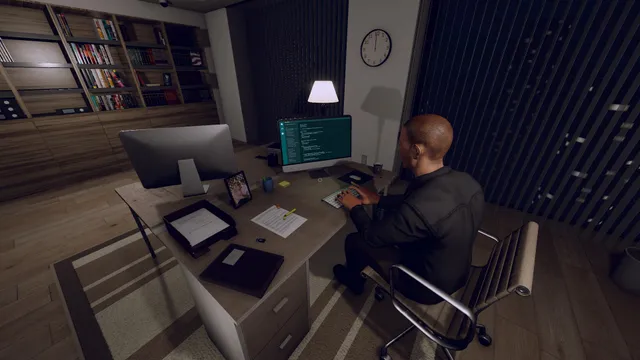 A man working at a computer in a dark office late at night, from the Alice and Bob night shift story