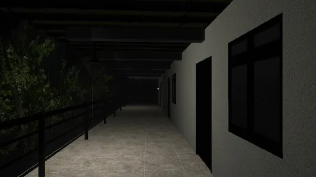 A long, dark covered walkway beside a building at night