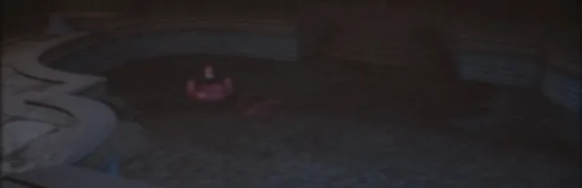 The Backrooms 1998 key art: a dark, empty tiled pool room with a pink inflatable ring floating in the gloom